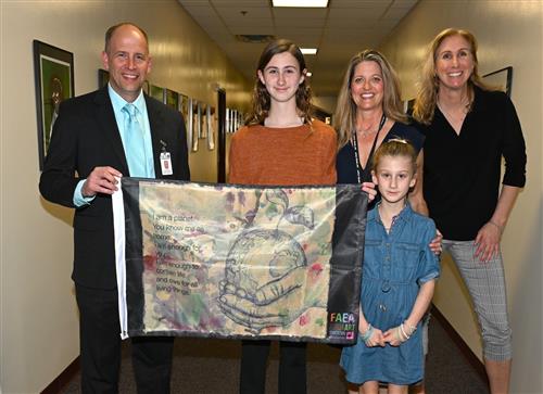  Family holding up flag